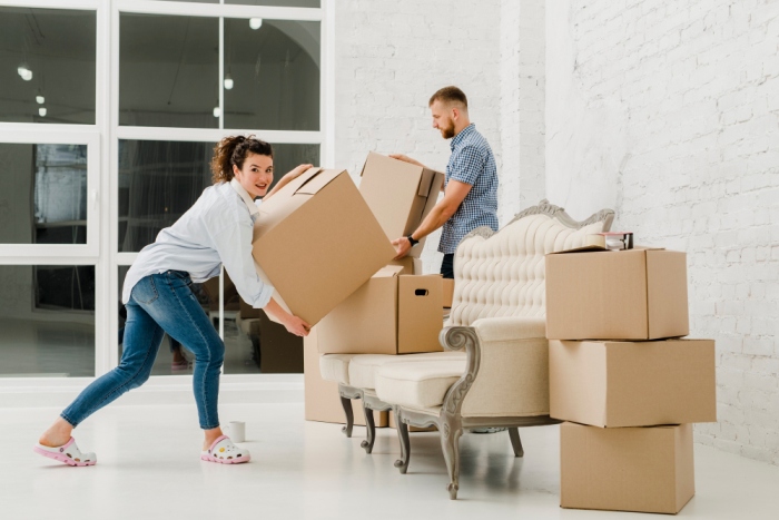 Freepik Couple sorting cardboard boxes