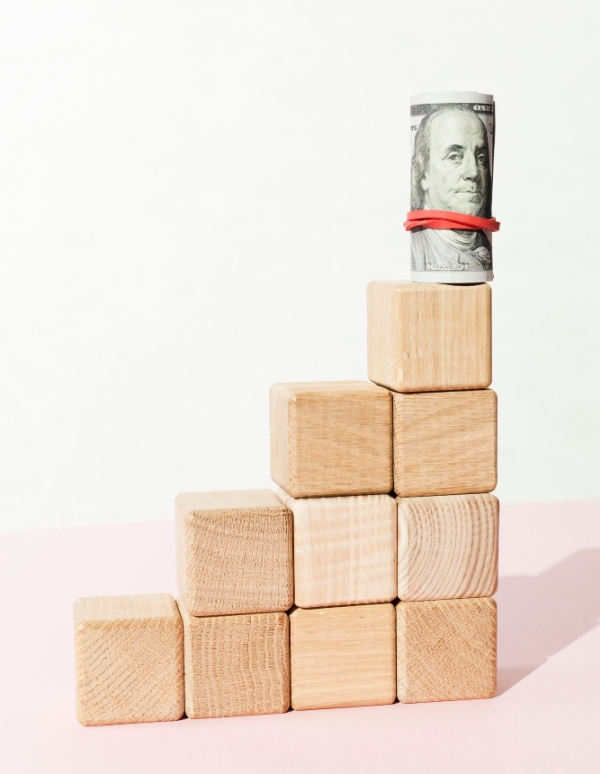Freepik US Banknote on wooden stairs made of cubes Freepik US Banknote on wooden stairs made of cubes
