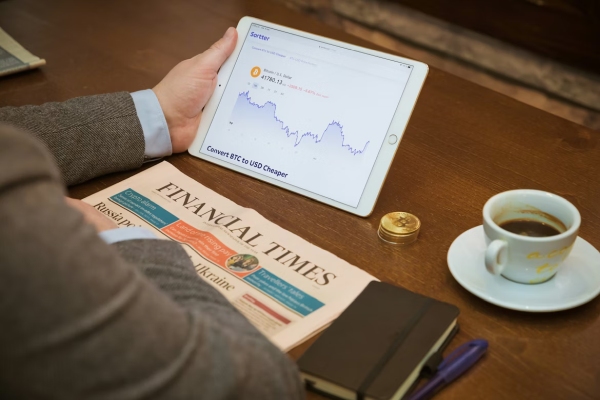 Unsplash Sortter, Person sitting at table with a cup of coffee