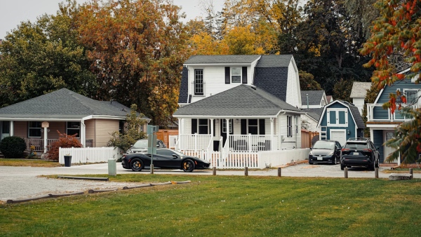 Unsplash – Anthony Fomin, A couple of cars parked in front of a house